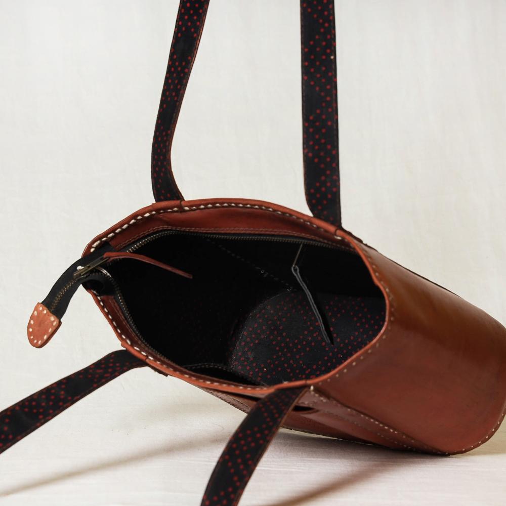 Handcrafted Kutch leather shoulder bag.