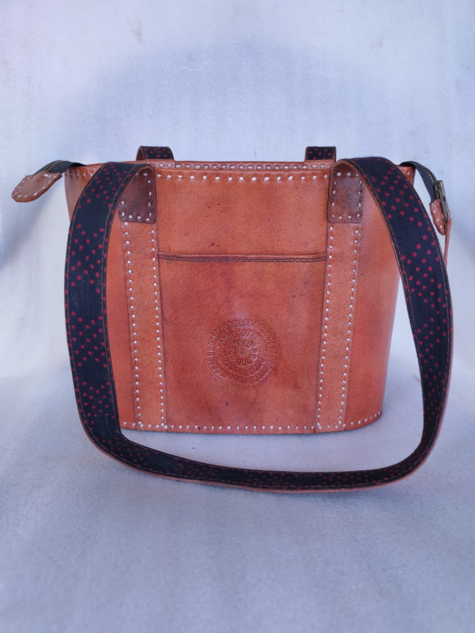 Handcrafted Kutch leather shoulder bag.
