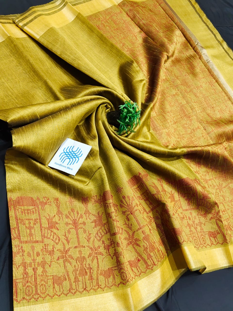 Semi raw silk saree with tribal figure border