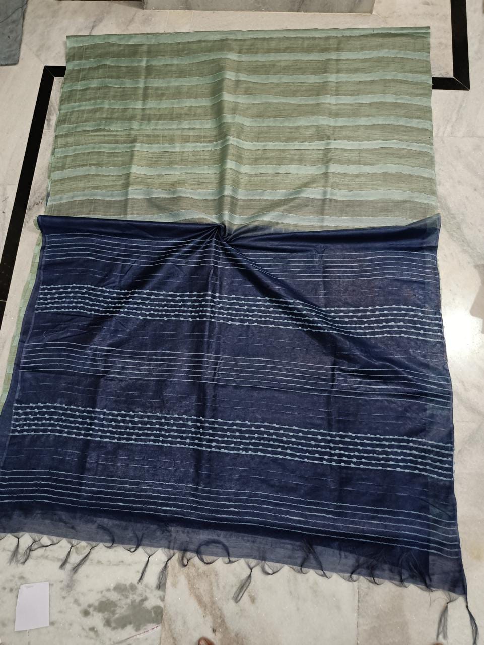 Semi tussar silk saree with white flag strip body and hand beading pallu