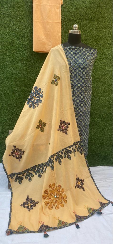 Ajrakh print dress materials with hand applique work
