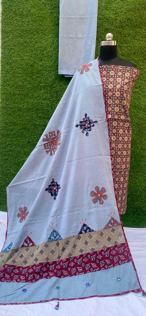 Ajrakh print dress materials with hand applique work